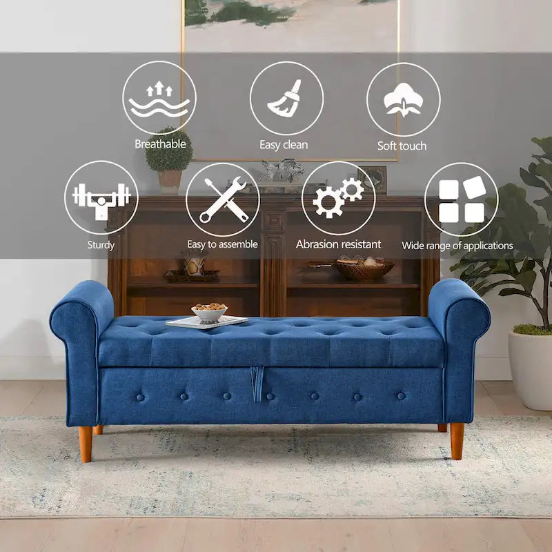 Banc de rangement capitonné en tissu bleu avec accoudoirs roulés et pieds en bois